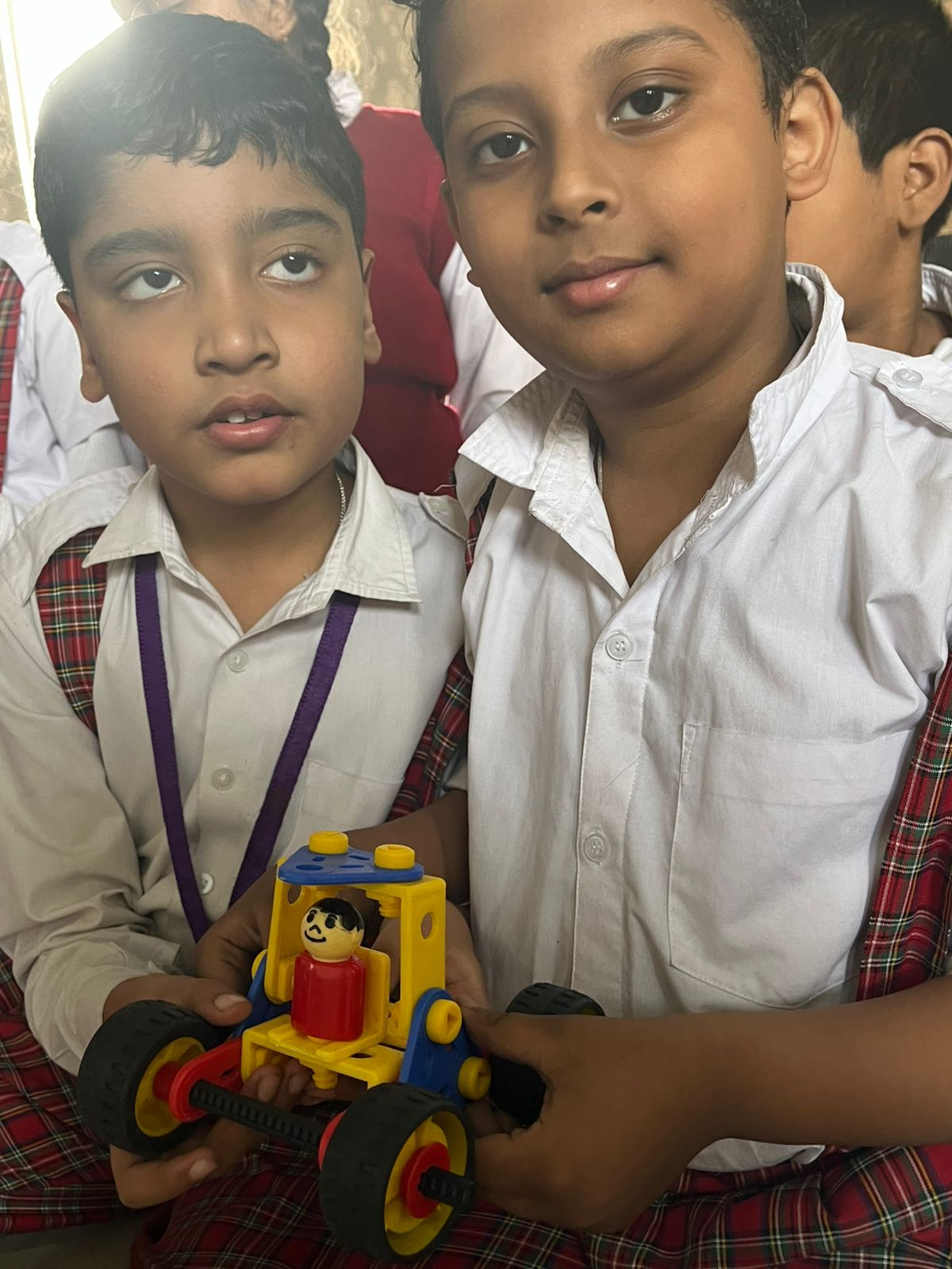 Students observing and learning during a STEM session